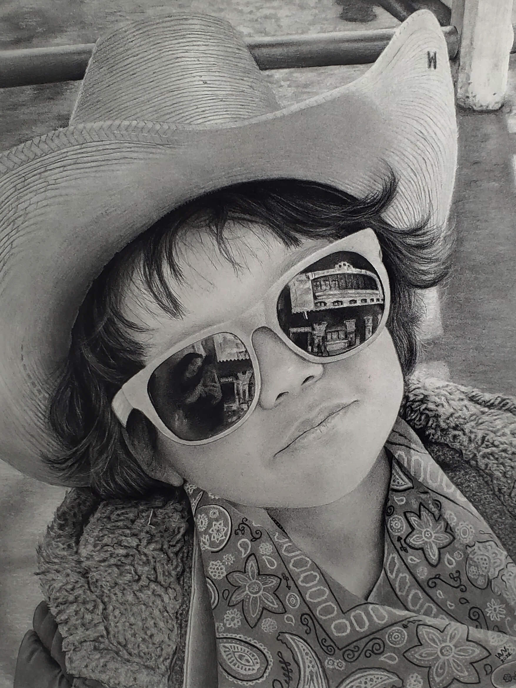 Charcoal drawing of a boy wearing a cowboy hat and sunglasses.